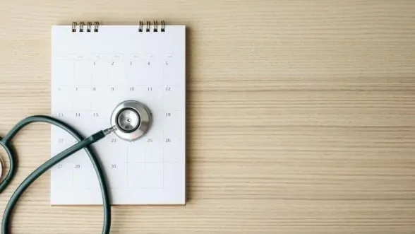 Stethoscope on a calendar for annual physicals