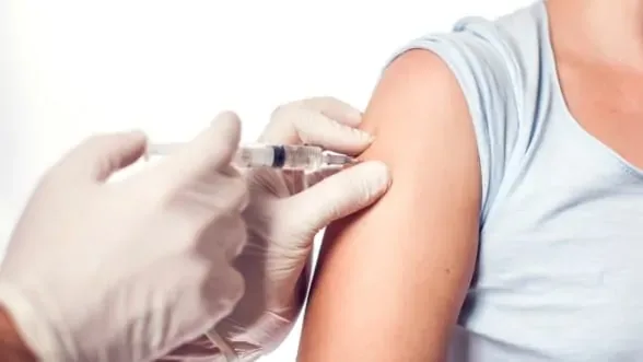 Patient receiving a flu shot injection